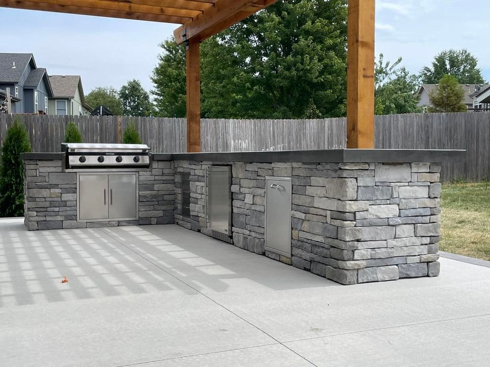 Gallery photos for Elegant Outdoor Living Space Featuring Concrete Patio and Pergola in Olathe: Image #4