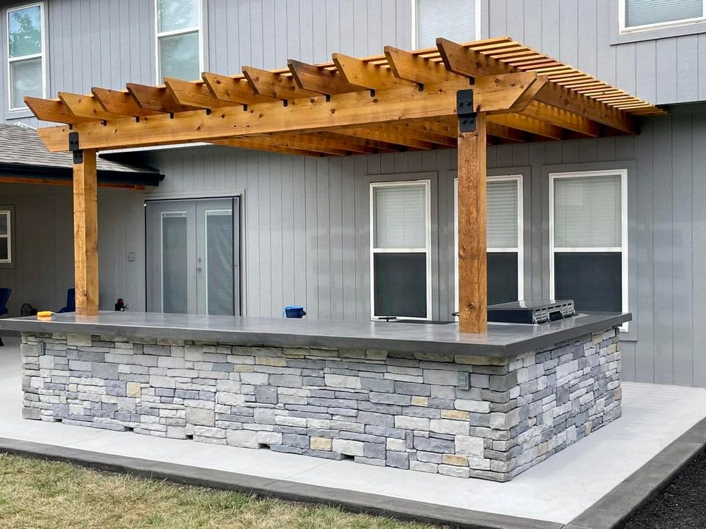 Gallery photos for Elegant Outdoor Living Space Featuring Concrete Patio and Pergola in Olathe: Image #2