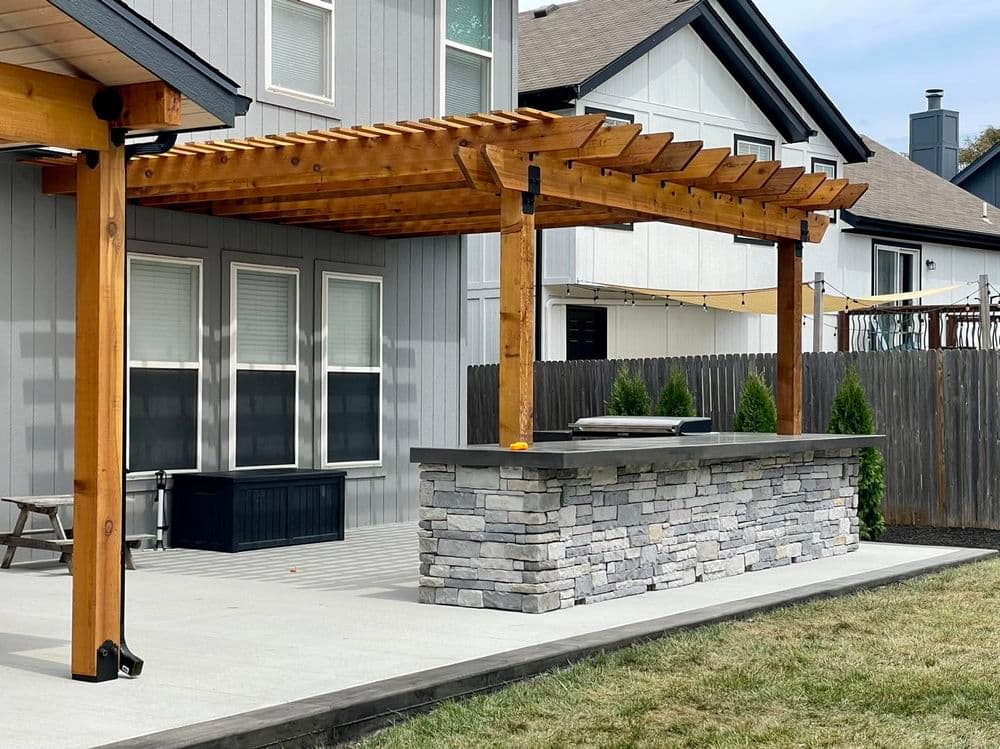 Gallery photos for Elegant Outdoor Living Space Featuring Concrete Patio and Pergola in Olathe: Image #3