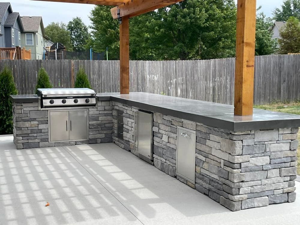 Gallery photos for Elegant Outdoor Living Space Featuring Concrete Patio and Pergola in Olathe: Image #5