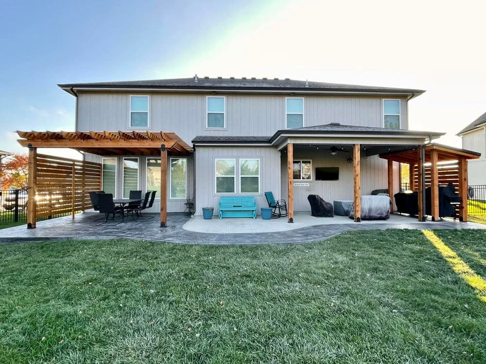 Stamped Concrete Patio with Stylish Pergola and Grill Station in Kansas City image