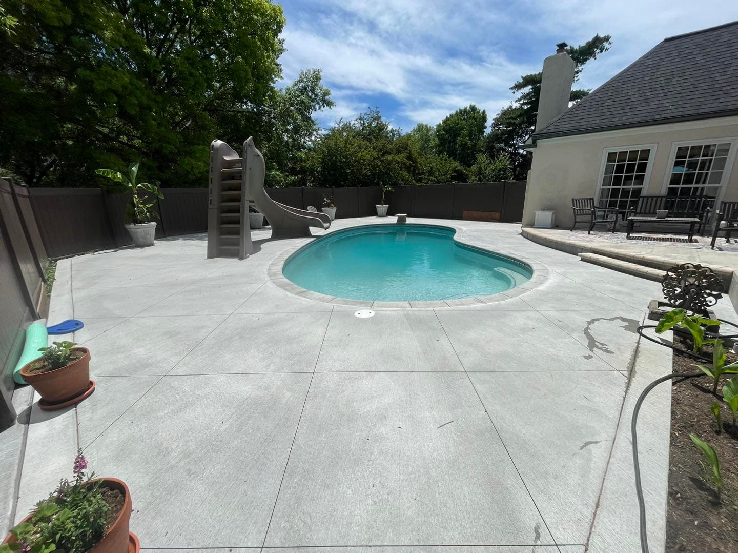 Backyard pool with slide